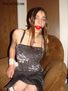 staciesnowbound.com - Stiletto in a sexy dress, bound and ball gagged thumbnail
